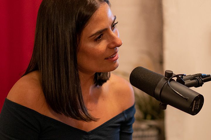 Podcast guest speaking into a Shure SM7B at Material Studios